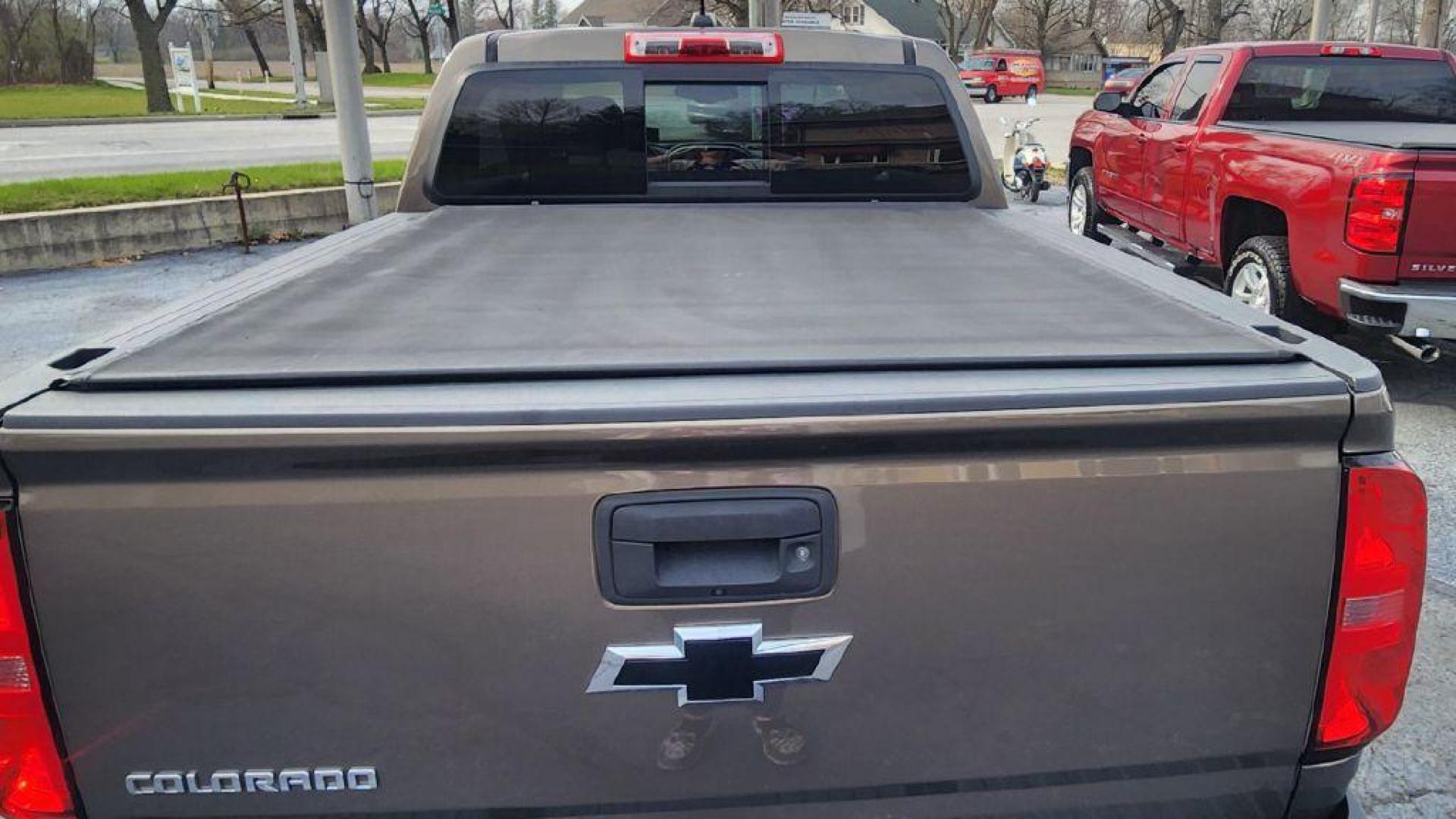 2016 BRONZE CHEVROLET COLORADO Z71 - 4WD (1GCGTDE36G1) with an 3.6L engine, Automatic transmission, located at 101 S. Halleck St., DeMotte, 46310, (219) 987-2922, 41.202343, -87.198189 - Photo#7